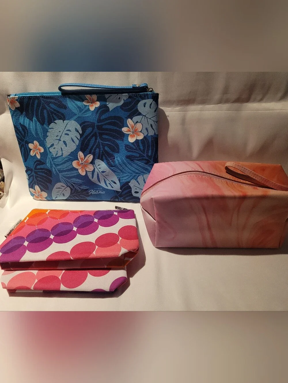 Clinique Set, Blue Hawaii, and Pink/Orange  Pouches.